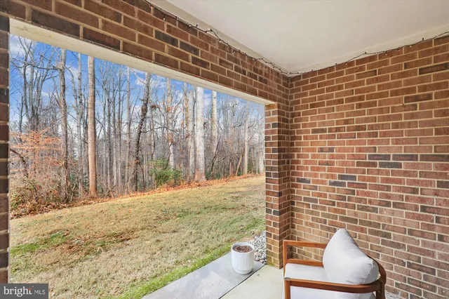a view of a brick house with many windows