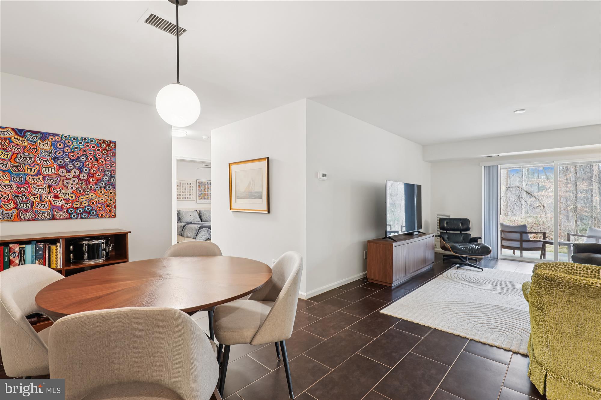 5802 Cove Landing Road, Unit 101 Burke, VA 22015 - Photo 10 of 35 a living room with furniture and a flat screen tv