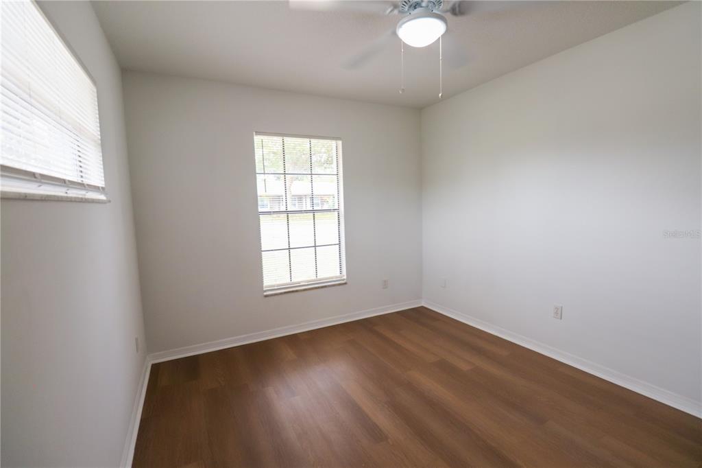 708 Camden Road Altamonte Springs, FL 32714 - Photo 25 of 42 The second bedroom, two windows and with a ceiling fan.