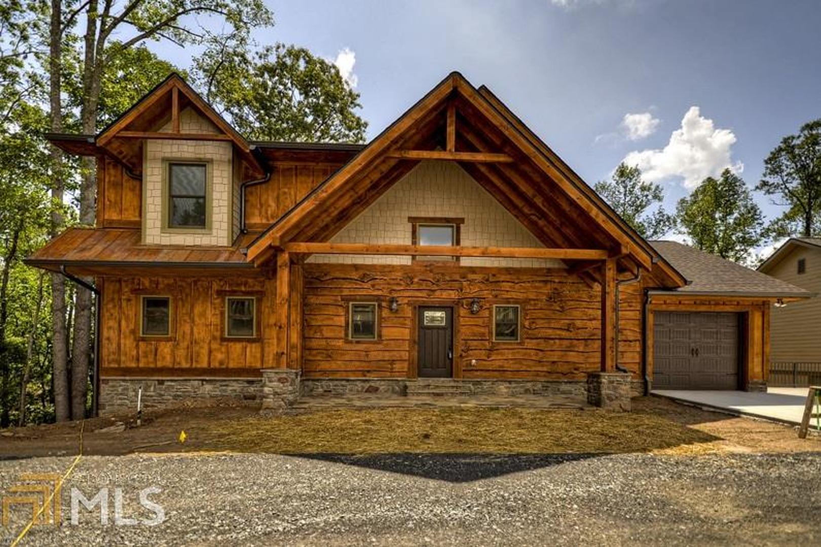 0 Overlook At Branch, Unit 22 Blue Ridge, GA 30513 - Photo 1 of 1 a front view of a house with garden
