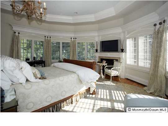 22 Heathcliff Road Rumson, NJ 07760 - Photo 14 of 19 a bedroom with a bed and a flat screen tv