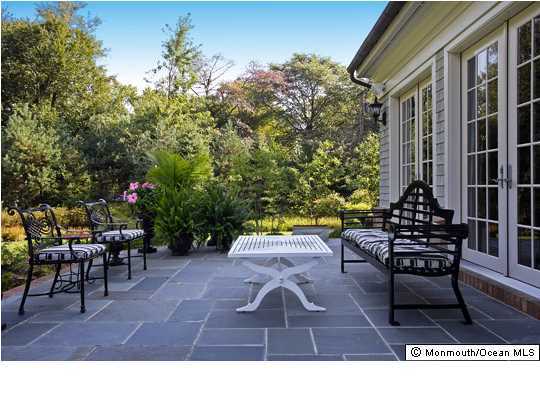 22 Heathcliff Road Rumson, NJ 07760 - Photo 19 of 19 a view of a tables and chairs in patio