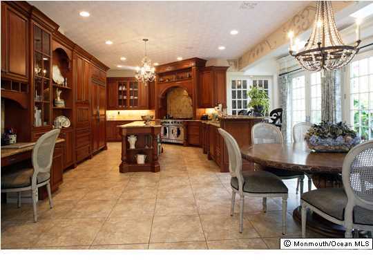 22 Heathcliff Road Rumson, NJ 07760 - Photo 9 of 19 a living room with stainless steel appliances furniture a dining table and a chandelier