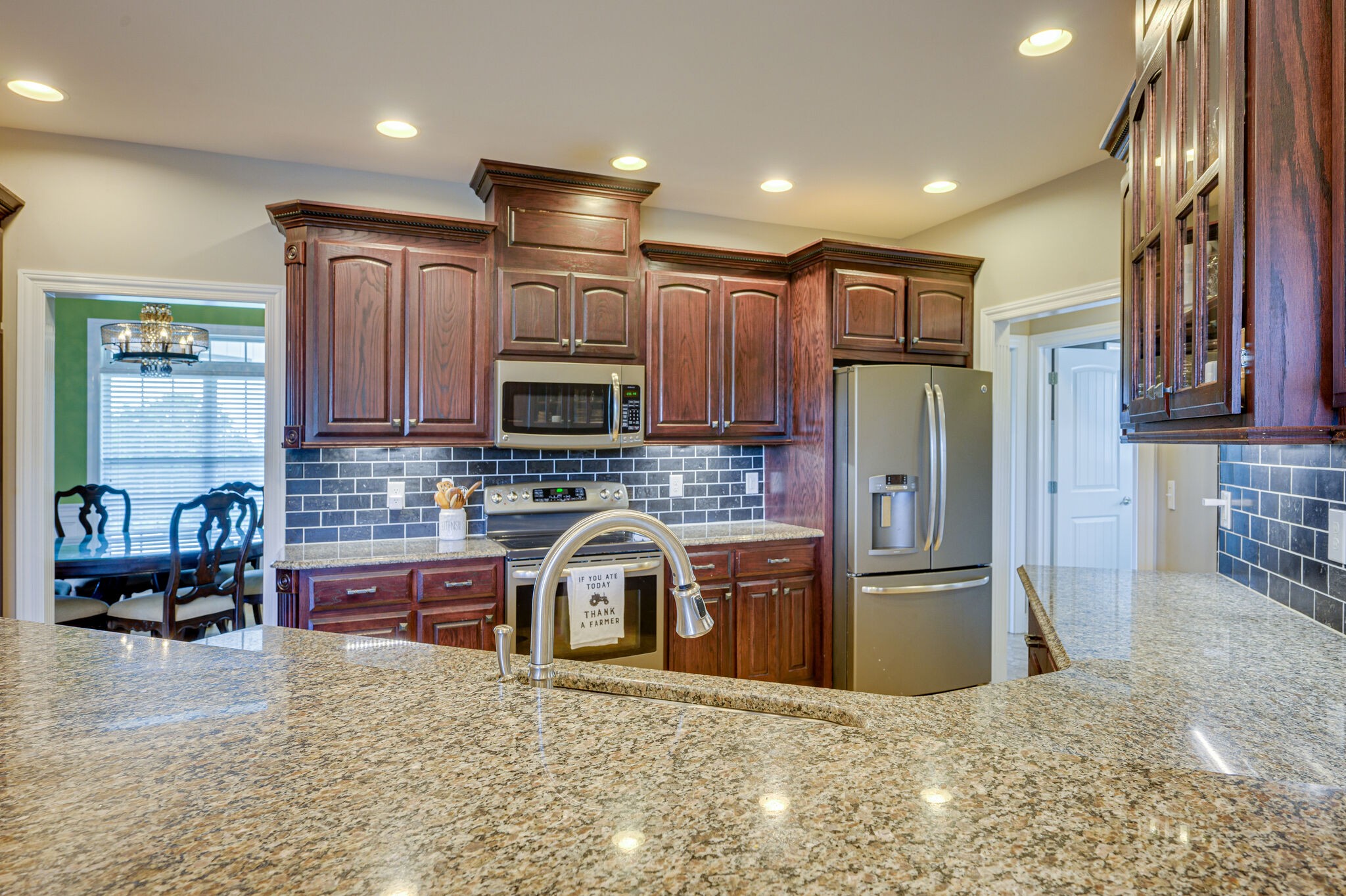 775 Ivy Lake Road Morrison, TN 37357 - Photo 12 of 69 a kitchen with stainless steel appliances granite countertop a refrigerator a stove top oven a sink and dishwasher