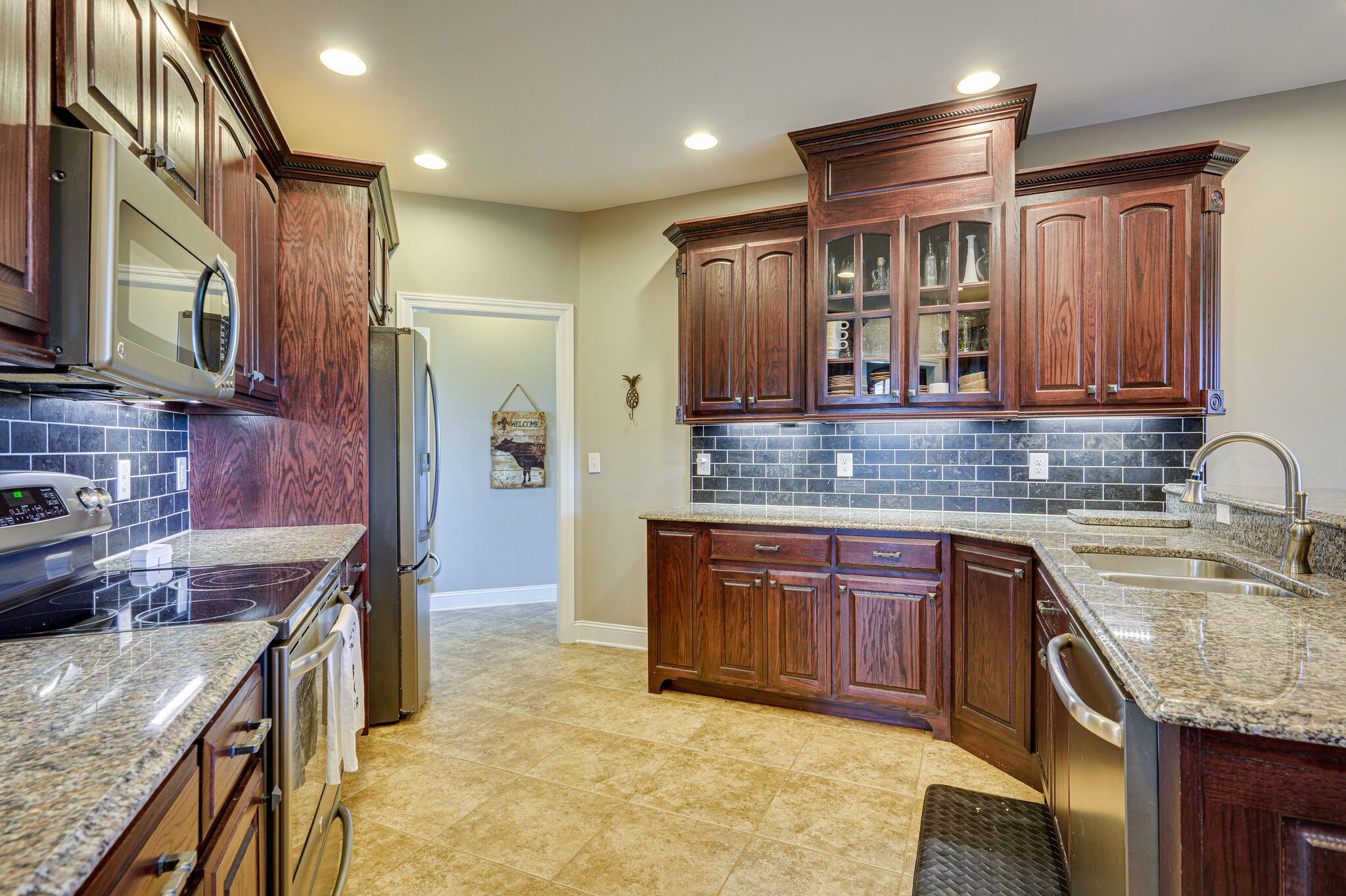 775 Ivy Lake Road Morrison, TN 37357 - Photo 13 of 69 a kitchen with stainless steel appliances granite countertop a sink stove and refrigerator
