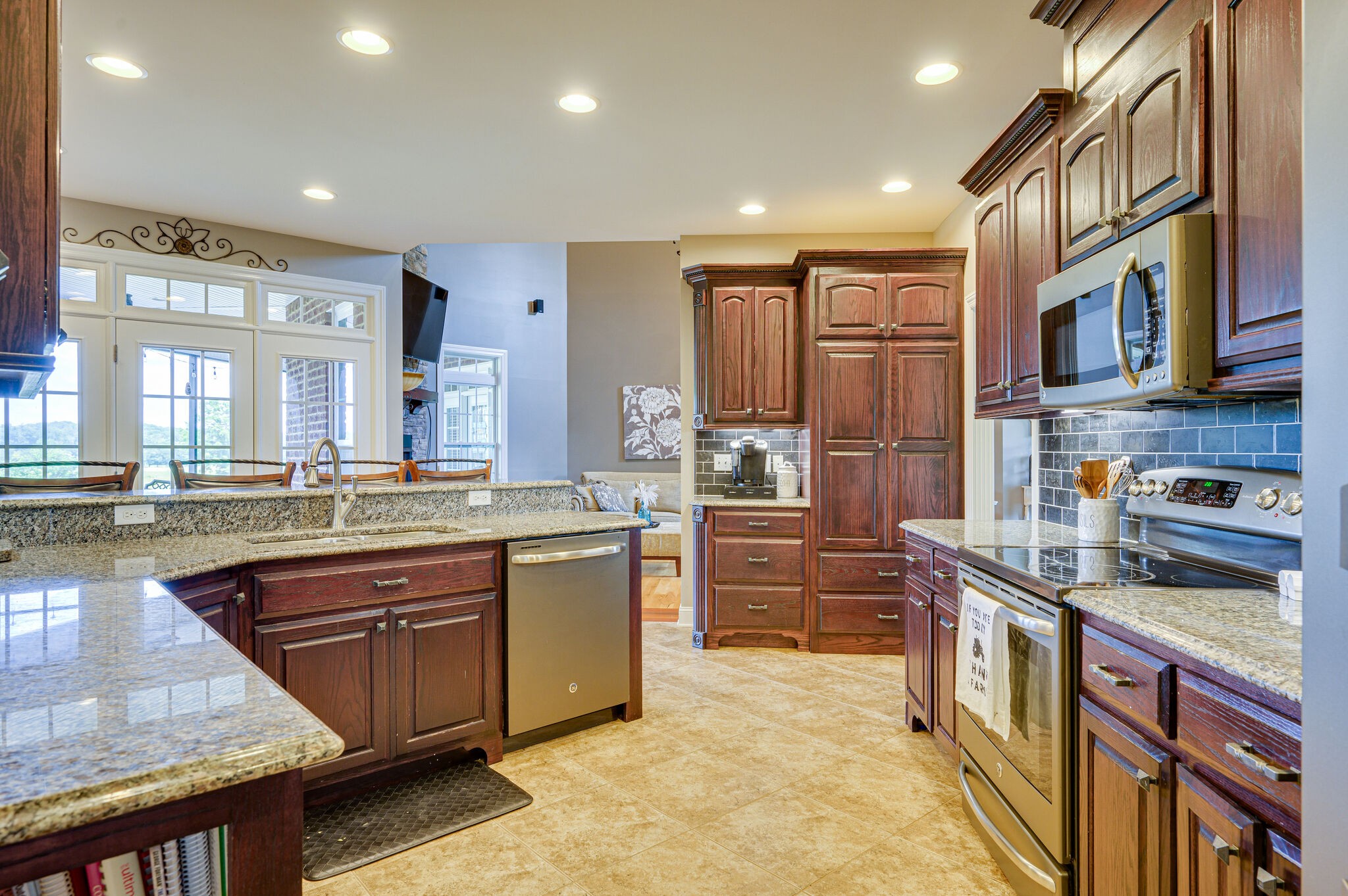 775 Ivy Lake Road Morrison, TN 37357 - Photo 14 of 69 a kitchen with stainless steel appliances granite countertop a stove a sink and a refrigerator