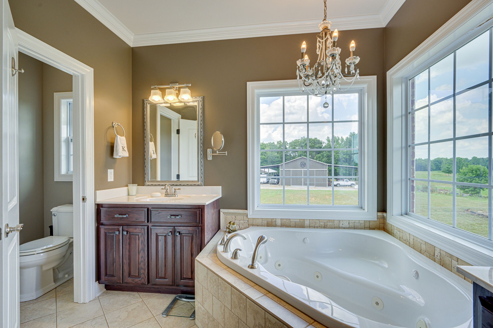 775 Ivy Lake Road Morrison, TN 37357 - Photo 19 of 69 a spacious bathroom with a granite countertop tub sink and mirror