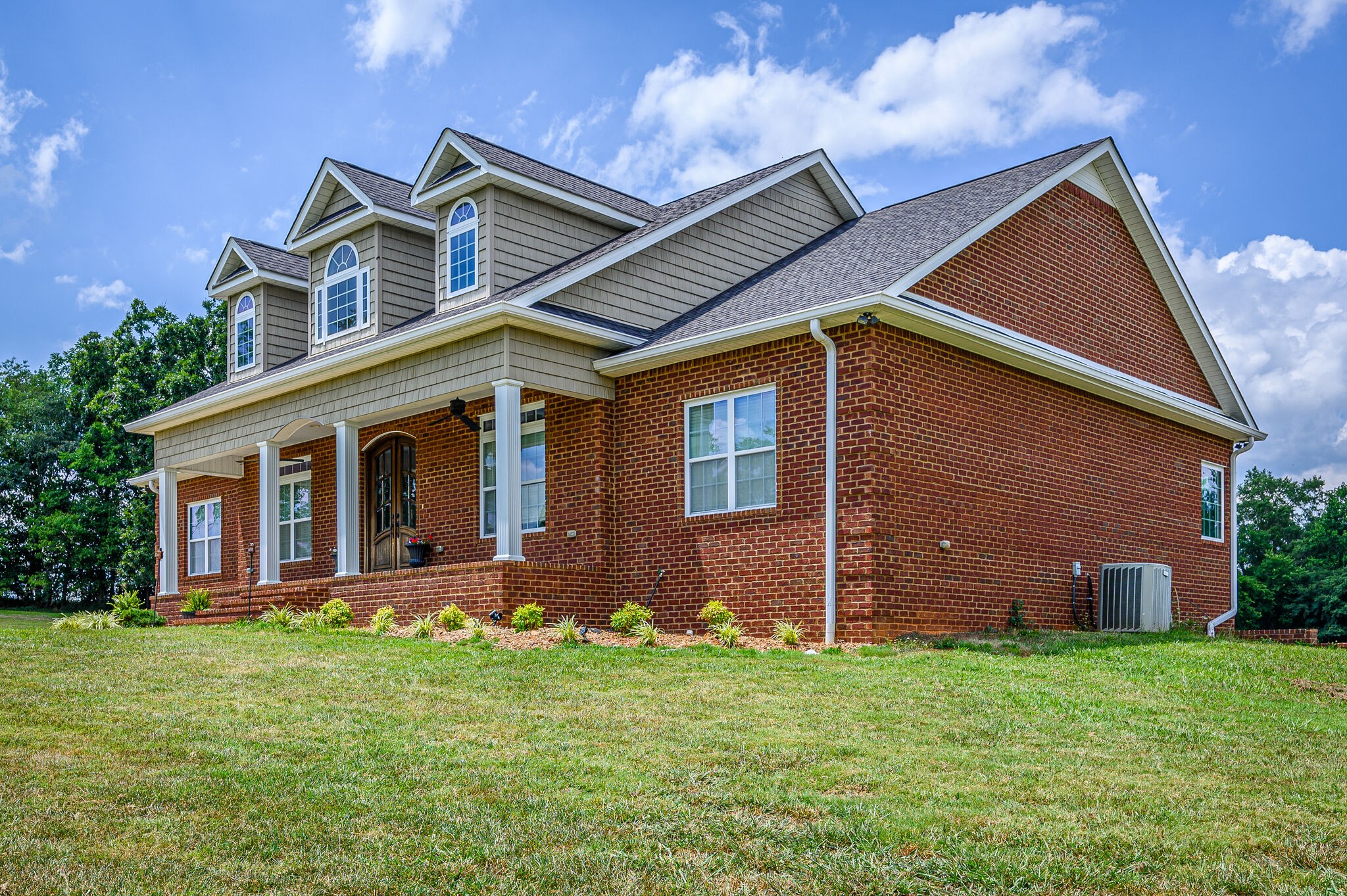 775 Ivy Lake Road Morrison, TN 37357 - Photo 2 of 69 a front view of a house with a garden