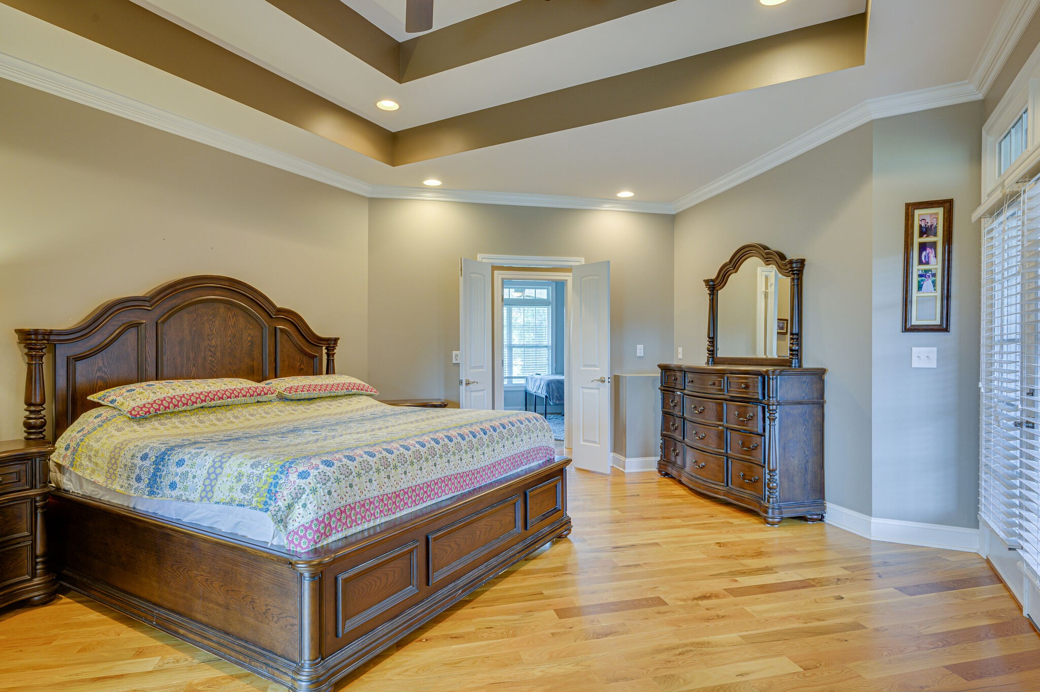 775 Ivy Lake Road Morrison, TN 37357 - Photo 21 of 69 a bedroom with a bed and dresser with mirror