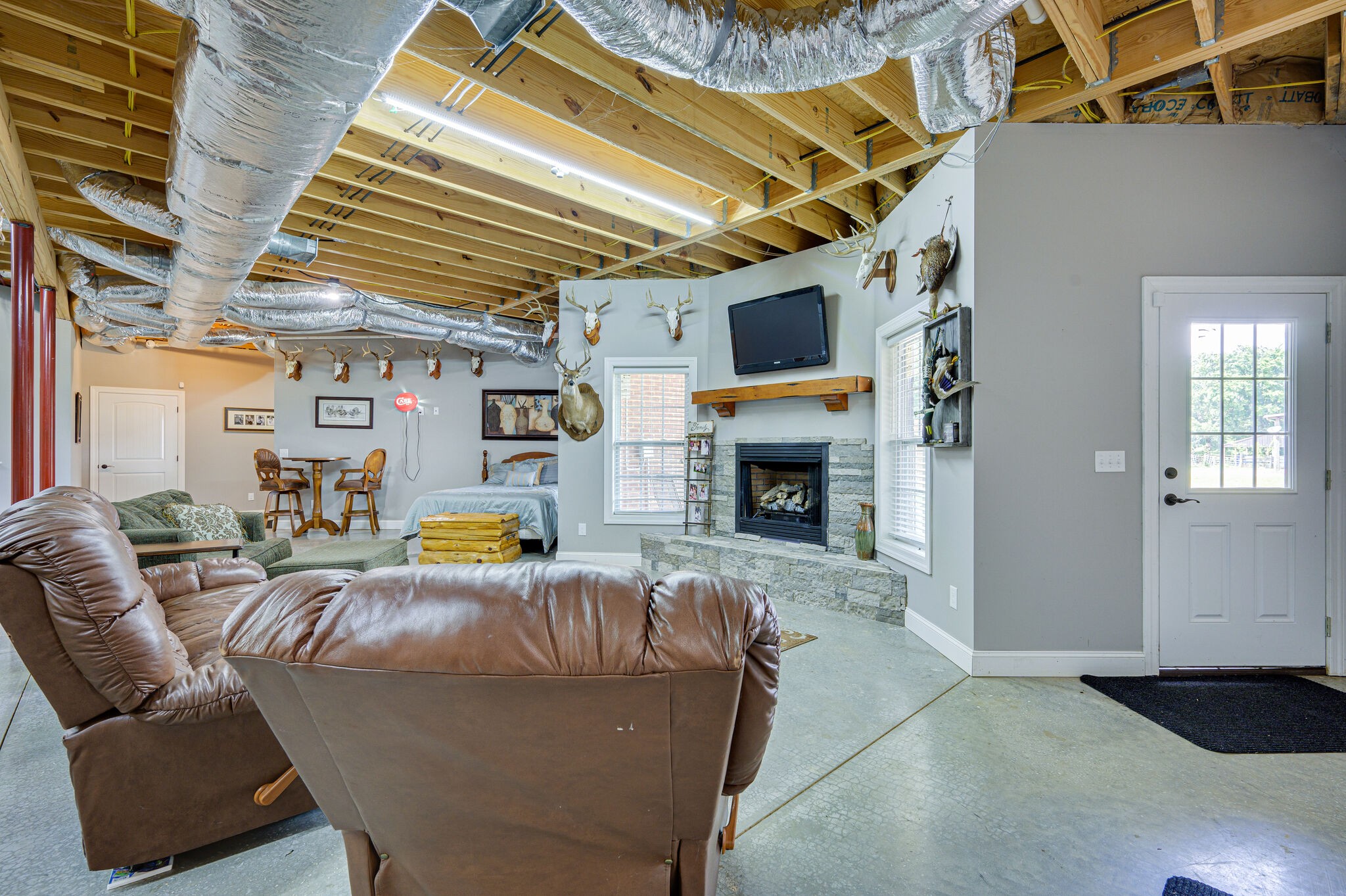 775 Ivy Lake Road Morrison, TN 37357 - Photo 35 of 69 a living room with furniture and a fireplace