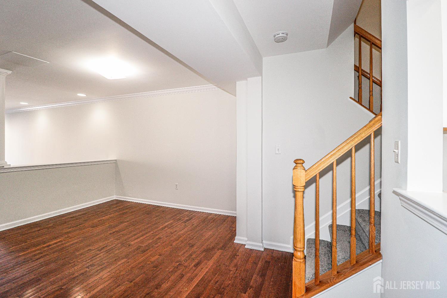 a view of an entryway with wooden floor