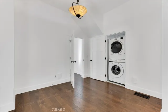 a view of a storage and utility room with washer and dryer