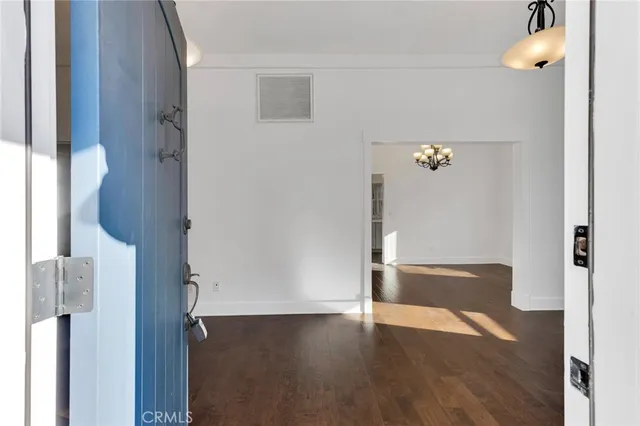 a view of an entryway with wooden floor