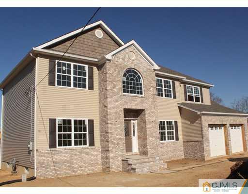 852 Ridge Road Monmouth Junction, NJ 08852 - Photo 1 of 8 a front view of a house with a yard