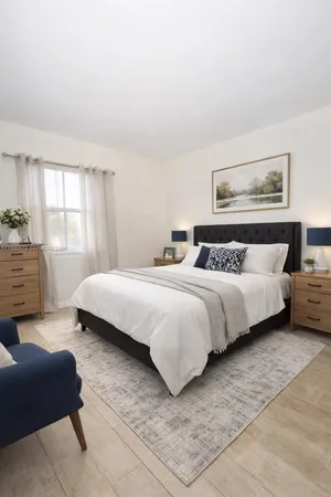 a bedroom with a bed and a couch