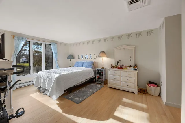 a bed room with a bed and a window