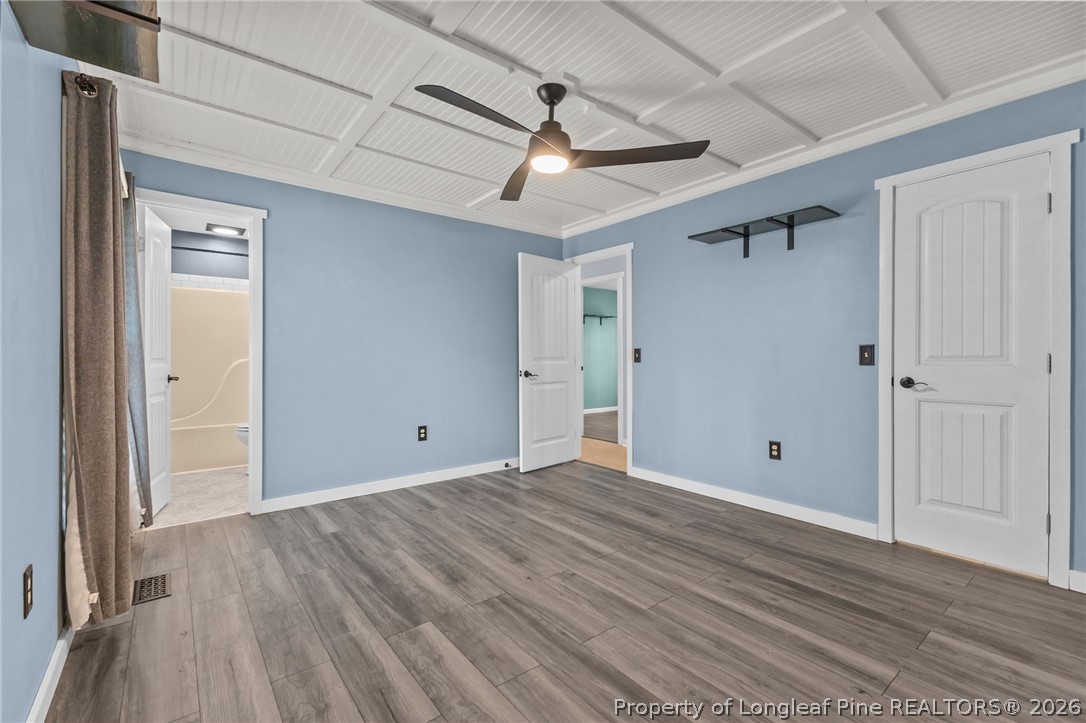 237 Lemuel Black Road Bunnlevel, NC 28323 - Photo 6 of 37 a view of an empty room with wooden floor