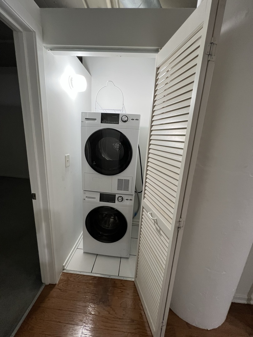 1525 South Sangamon Street, Unit 317P Chicago, IL 60608 - Photo 13 of 27 a view of a hallway with washer and dryer