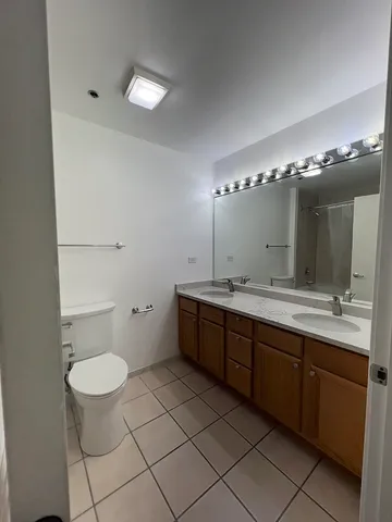 a kitchen with a sink a refrigerator and a stove