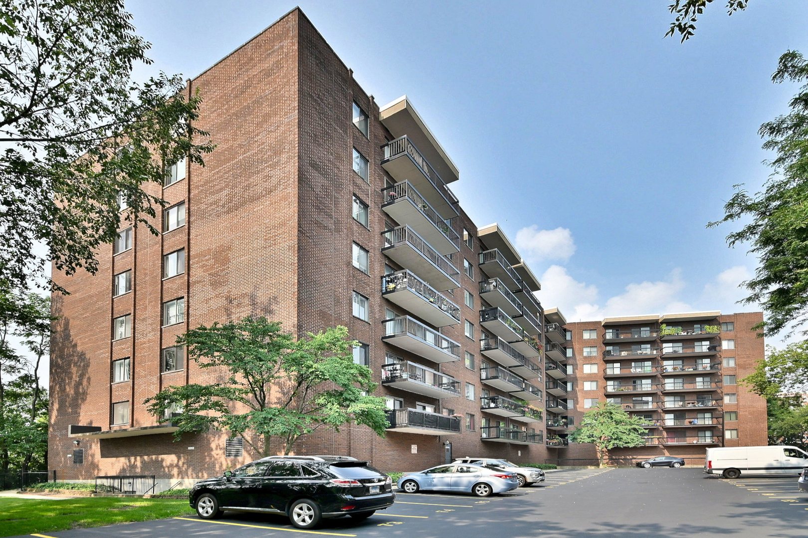 a car parked in front of brick building