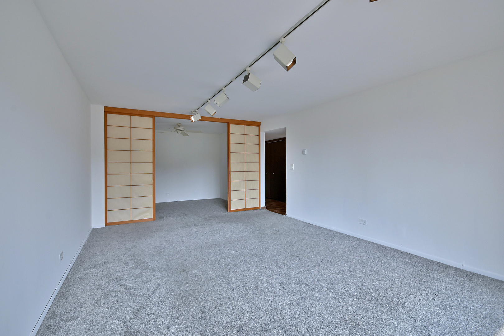 711 South River Road, Unit 508 Des Plaines, IL 60016 - Photo 11 of 41 a view of an empty room with a window and fireplace