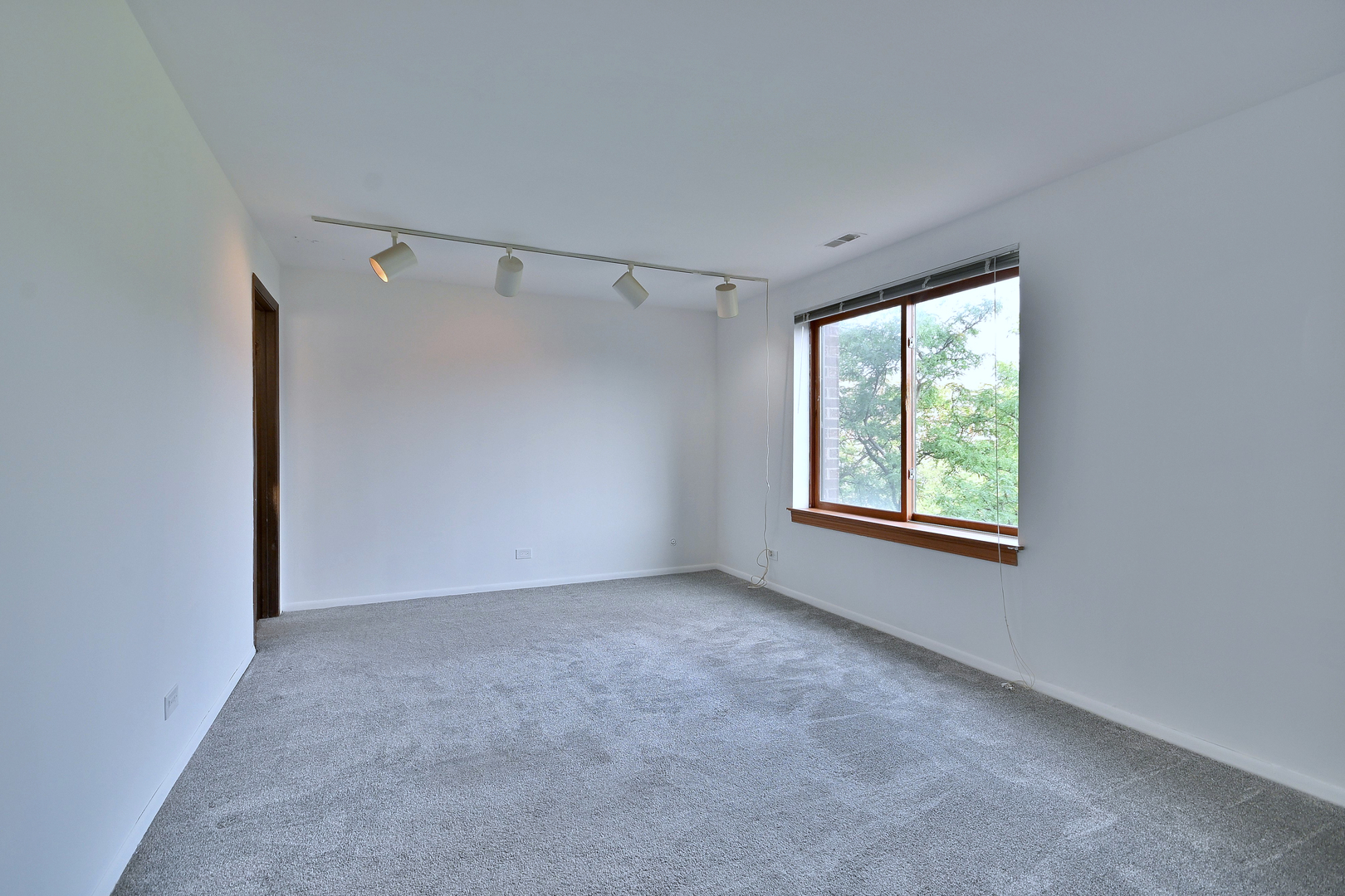 711 South River Road, Unit 508 Des Plaines, IL 60016 - Photo 16 of 41 a view of an empty room with a window