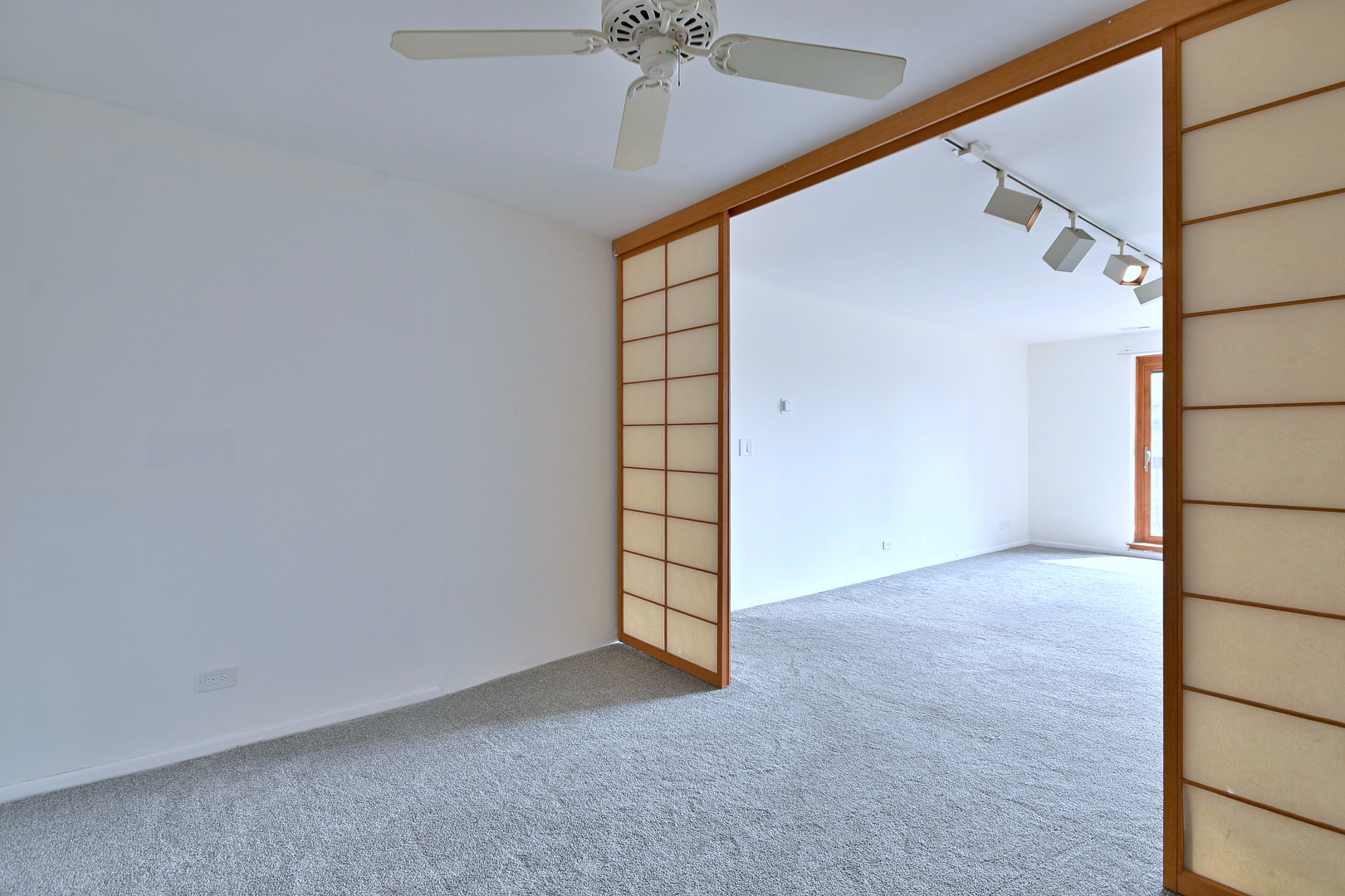 711 South River Road, Unit 508 Des Plaines, IL 60016 - Photo 20 of 41 an empty room with windows and fan