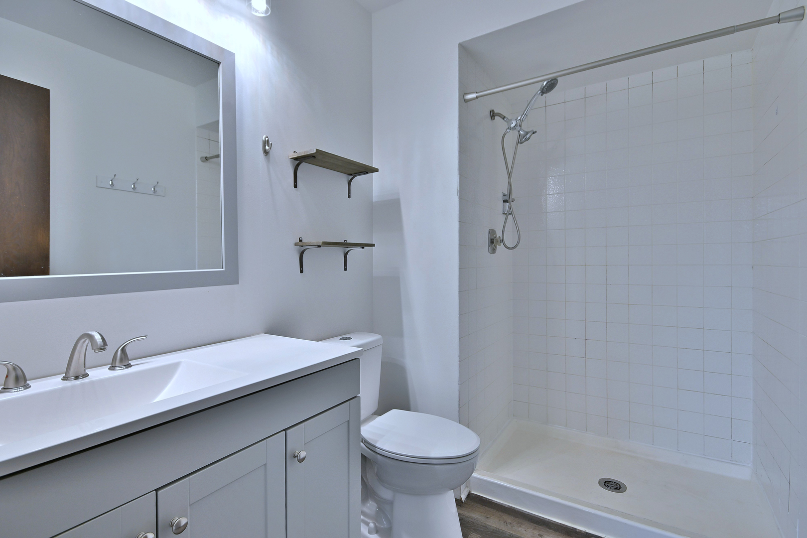 711 South River Road, Unit 508 Des Plaines, IL 60016 - Photo 21 of 41 a bathroom with a sink toilet and shower