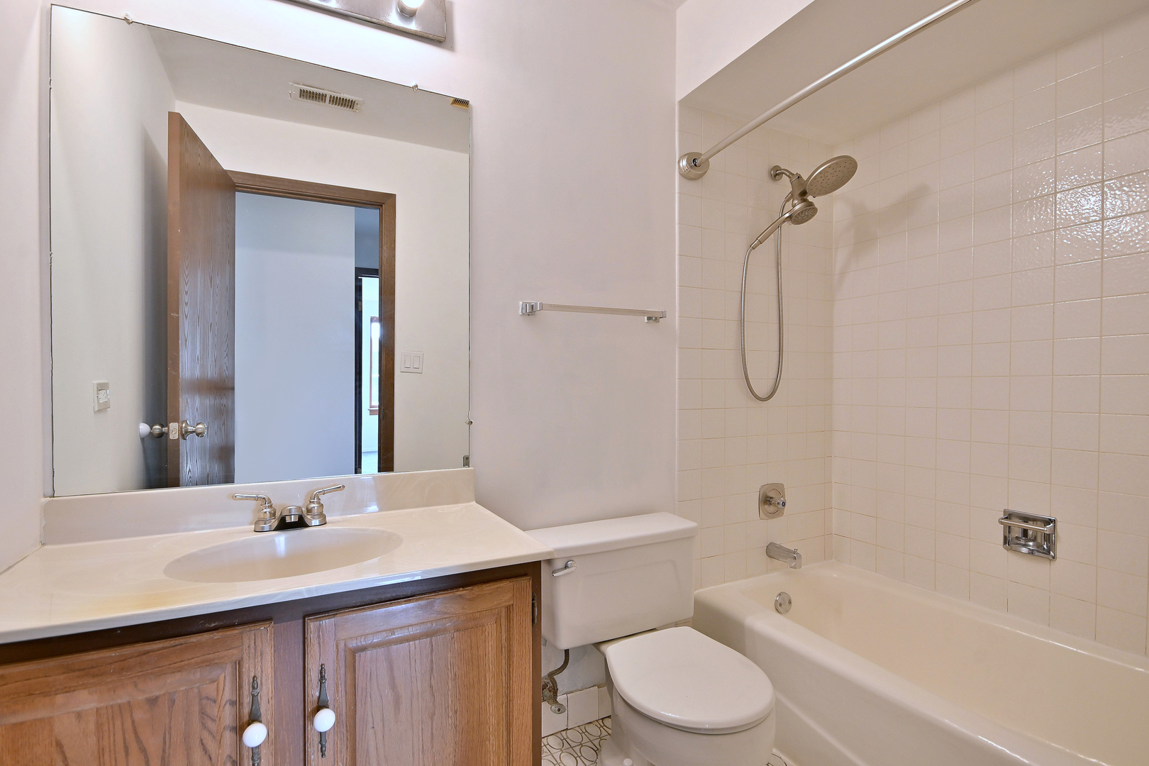 711 South River Road, Unit 508 Des Plaines, IL 60016 - Photo 23 of 41 a bathroom with a granite countertop sink toilet and shower