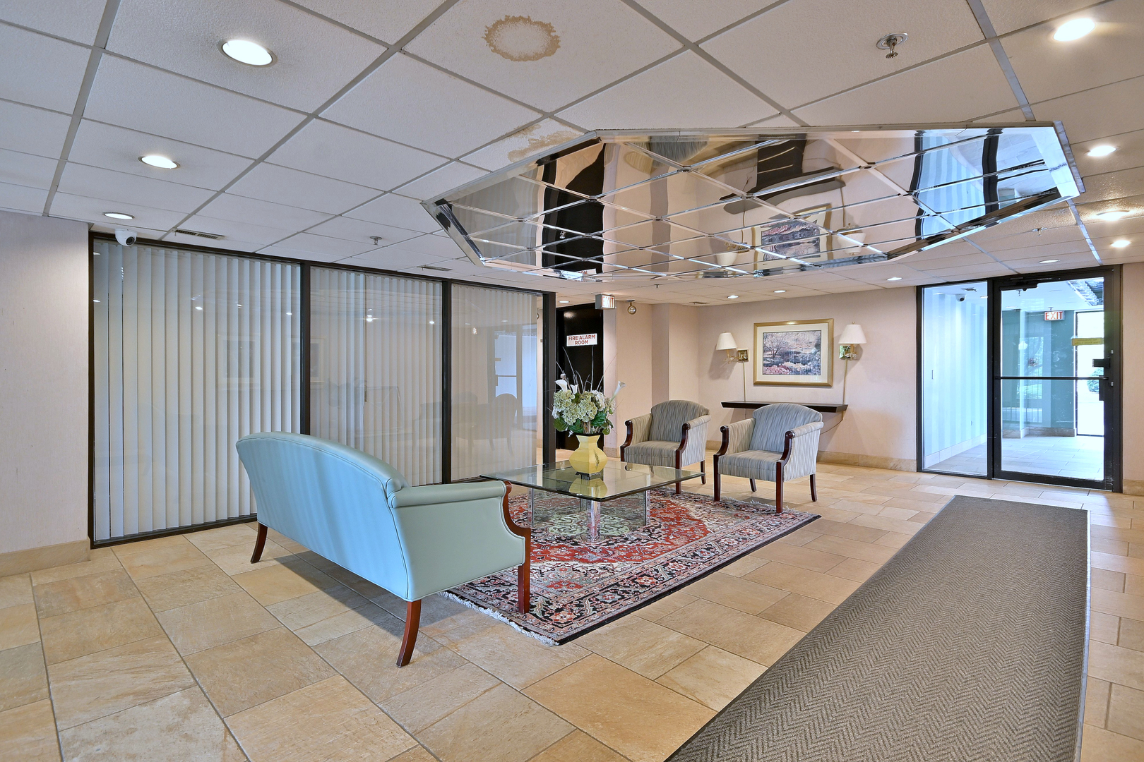 711 South River Road, Unit 508 Des Plaines, IL 60016 - Photo 29 of 41 a living room with furniture a ceiling fan and a rug