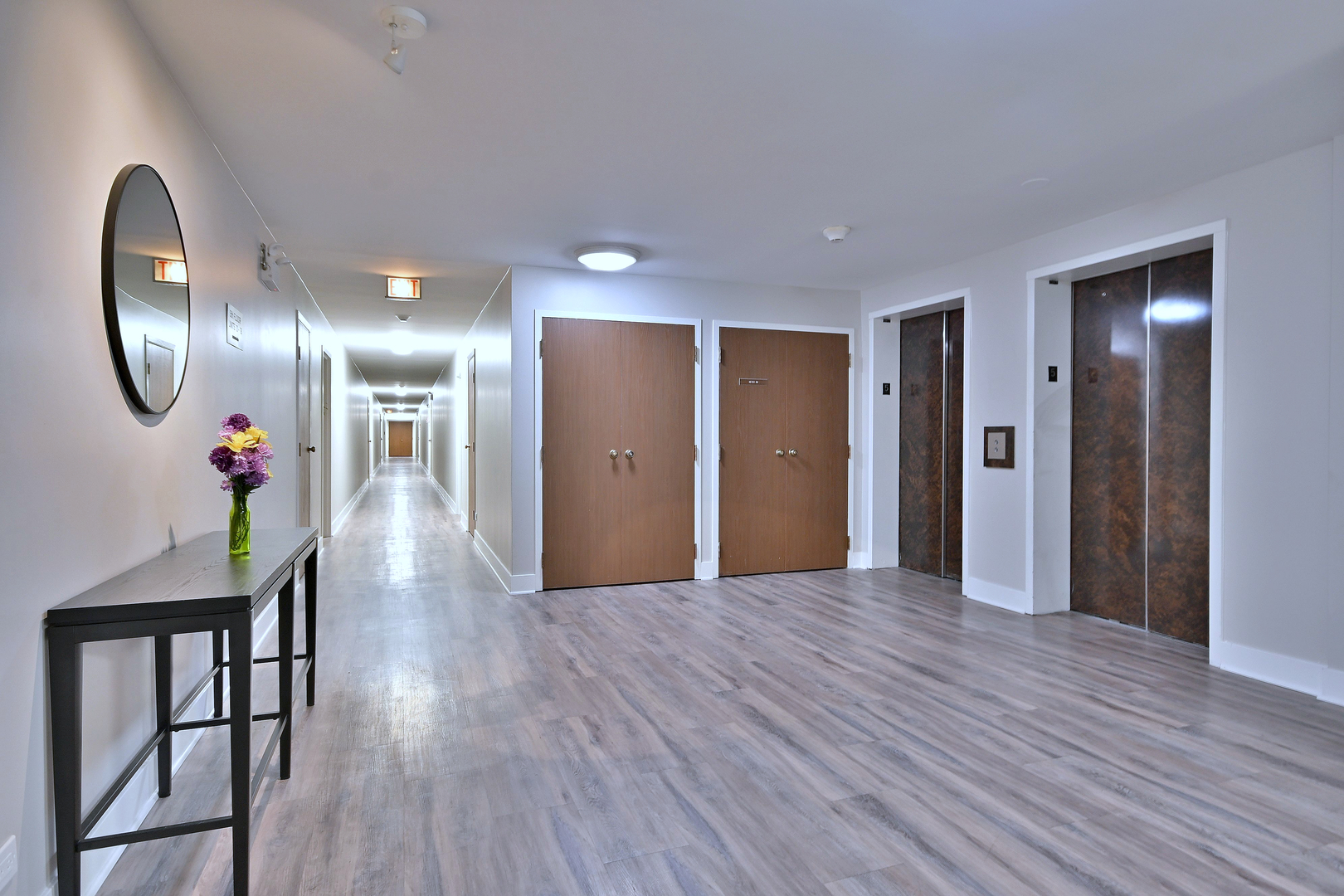 711 South River Road, Unit 508 Des Plaines, IL 60016 - Photo 30 of 41 a view of a hallway with wooden floor