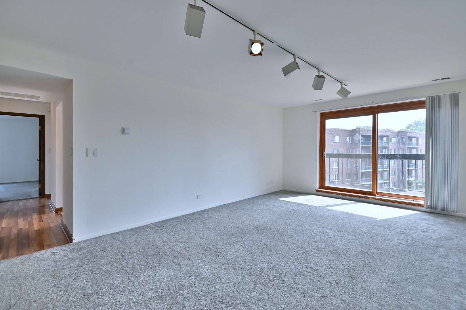 711 South River Road, Unit 508 Des Plaines, IL 60016 - Photo 3 of 41 a view of an empty room with a window