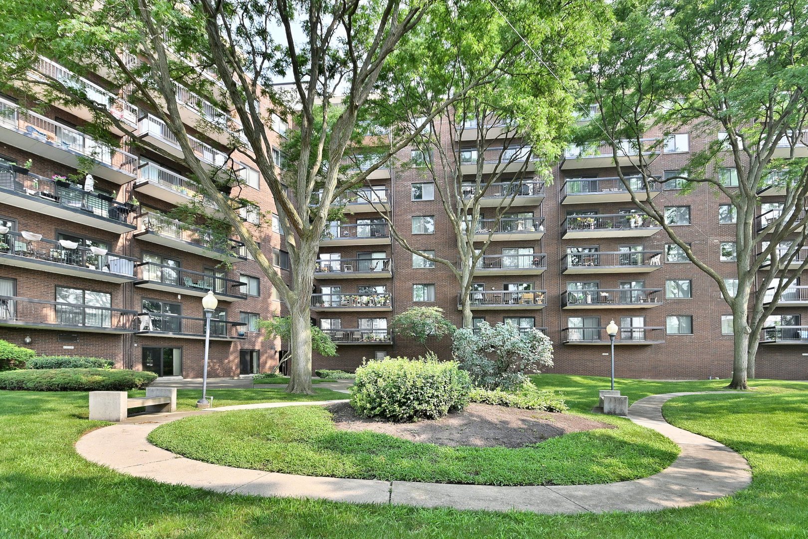 711 South River Road, Unit 508 Des Plaines, IL 60016 - Photo 38 of 41 a view of a building with garden