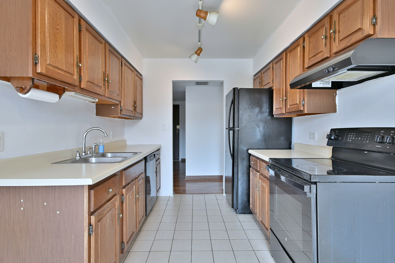 711 South River Road, Unit 508 Des Plaines, IL 60016 - Photo 4 of 41 a kitchen with granite countertop a sink stove and refrigerator