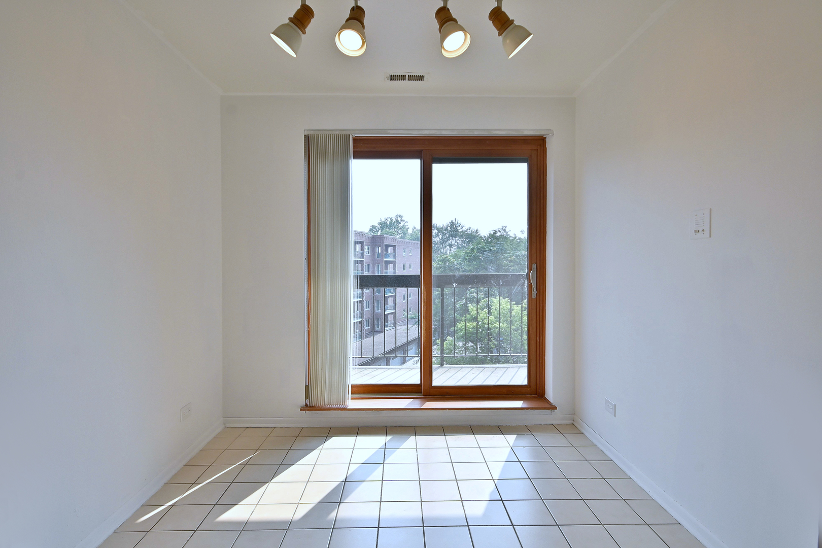 711 South River Road, Unit 508 Des Plaines, IL 60016 - Photo 6 of 41 a view of an empty room with a window