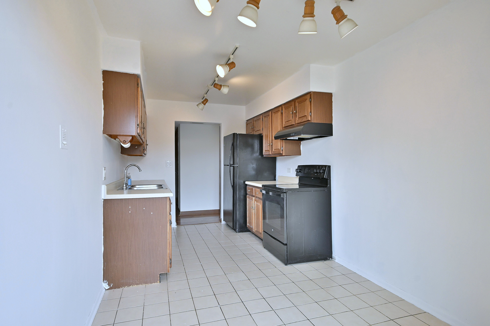 711 South River Road, Unit 508 Des Plaines, IL 60016 - Photo 7 of 41 a kitchen with stainless steel appliances a refrigerator and a sink