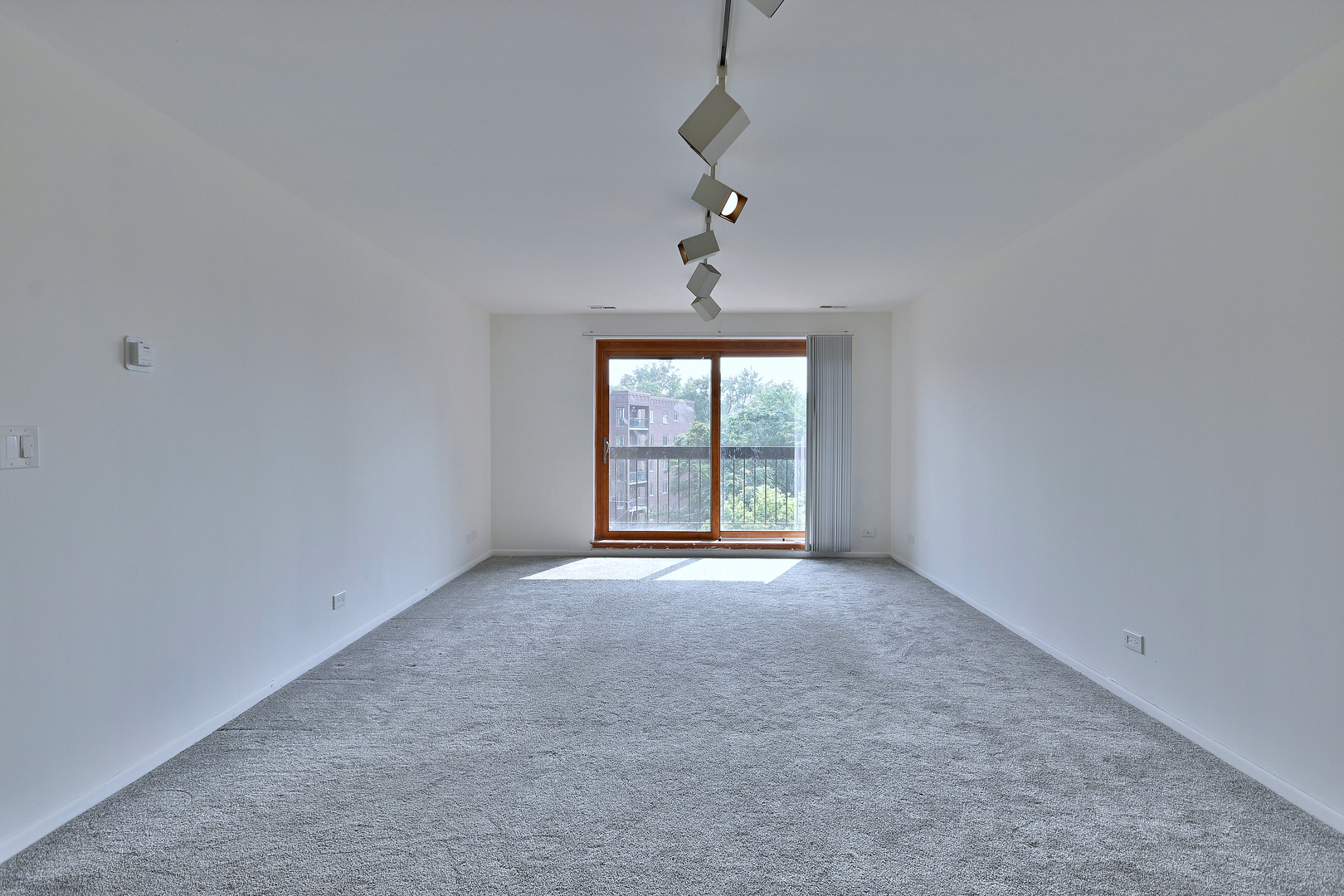 711 South River Road, Unit 508 Des Plaines, IL 60016 - Photo 8 of 41 a view of an empty room with a window