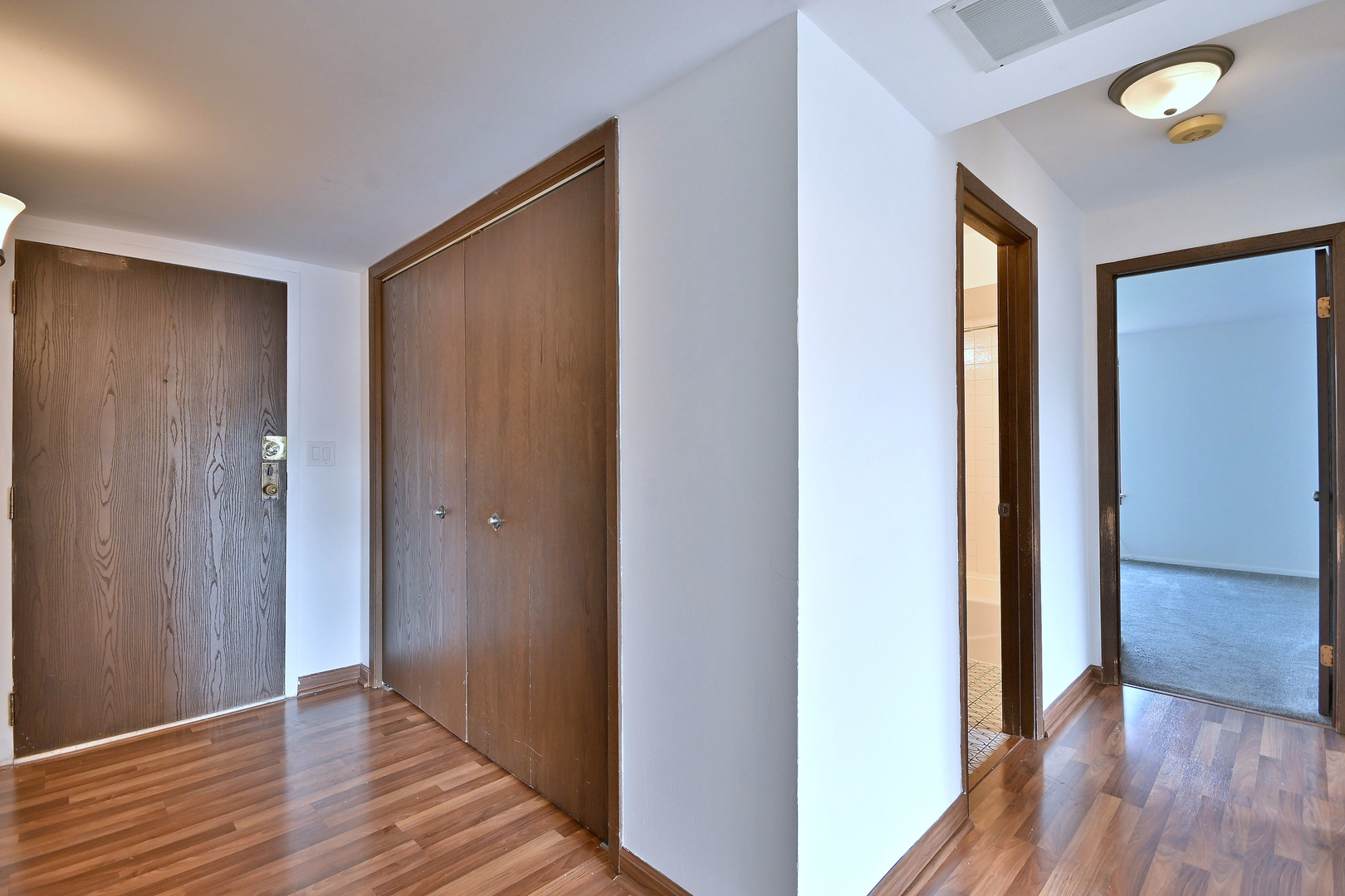 711 South River Road, Unit 508 Des Plaines, IL 60016 - Photo 9 of 41 a view of hallway with wooden floor