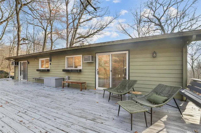a backyard of a house with table and chairs