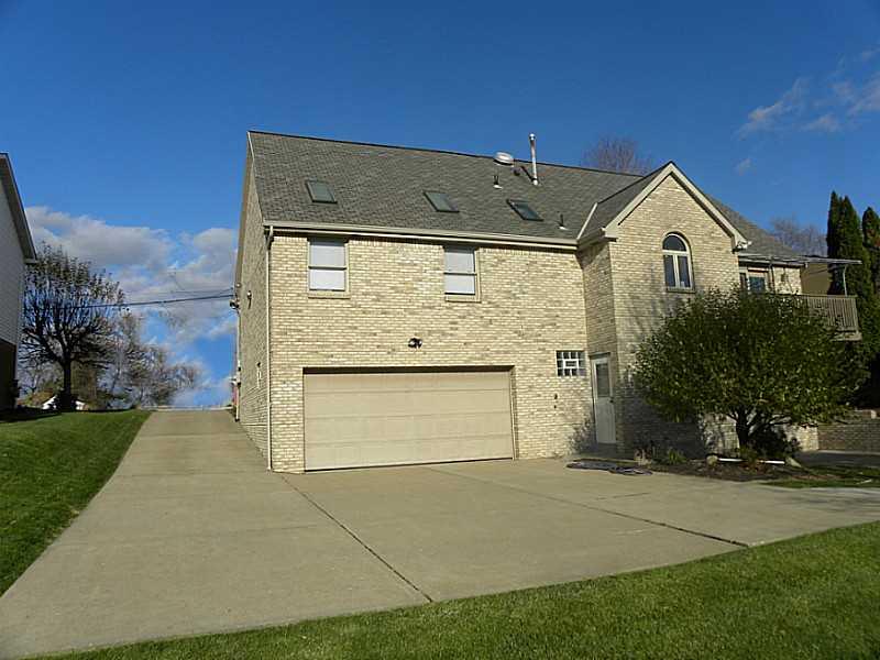 40 Revo Road Baldwin, PA 15236 - Photo 13 of 14 Exterior Back. All brick all the way around. To the right of the garage, entrance to mud room!