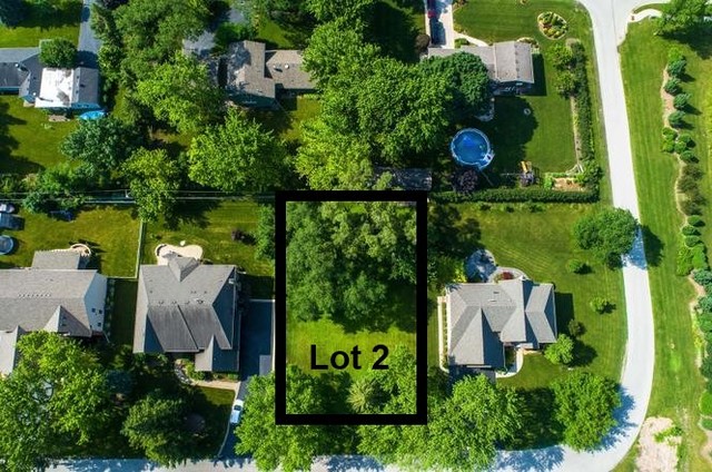 an aerial view of a house with swimming pool outdoor seating and yard