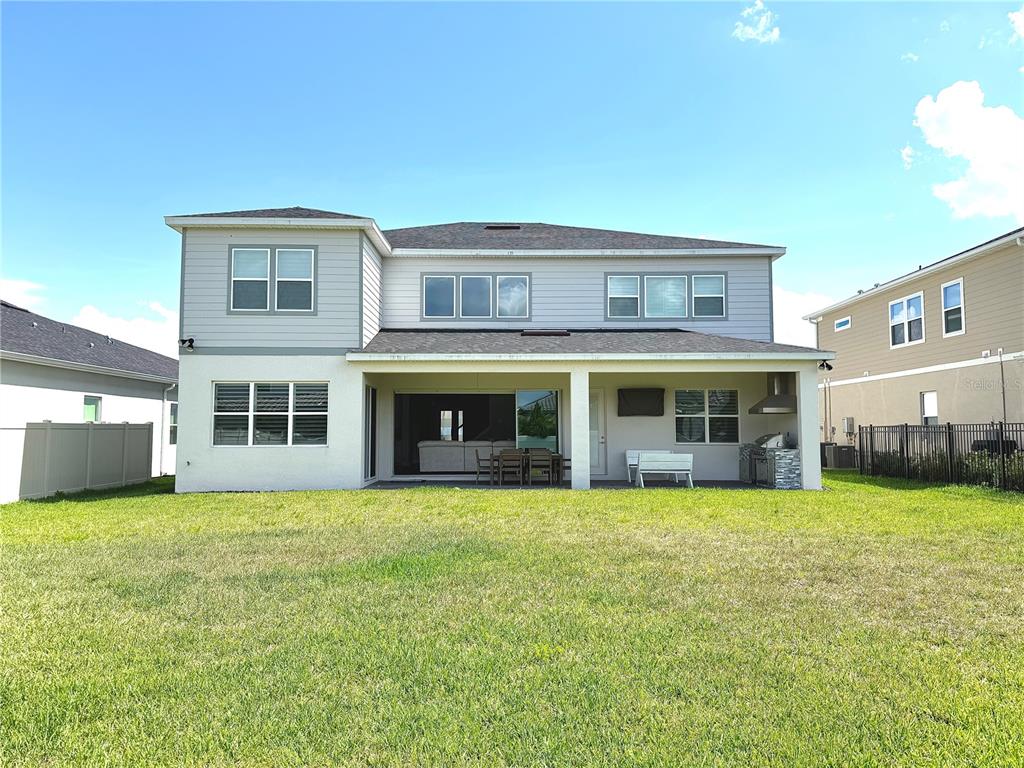 8441 Pk Clf Way Orlando, FL 32836 - Photo 59 of 59 a view of an apartment with a swimming pool and yard