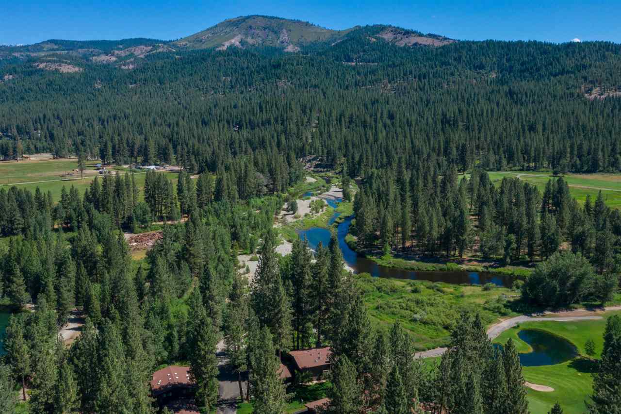 92 Graeagle Meadows Road Graeagle, CA 96103 - Photo 2 of 19 a view of a garden with a building in the background