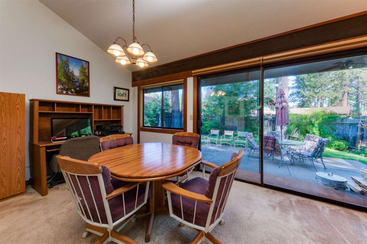 92 Graeagle Meadows Road Graeagle, CA 96103 - Photo 6 of 19 a dining room with furniture a chandelier and window