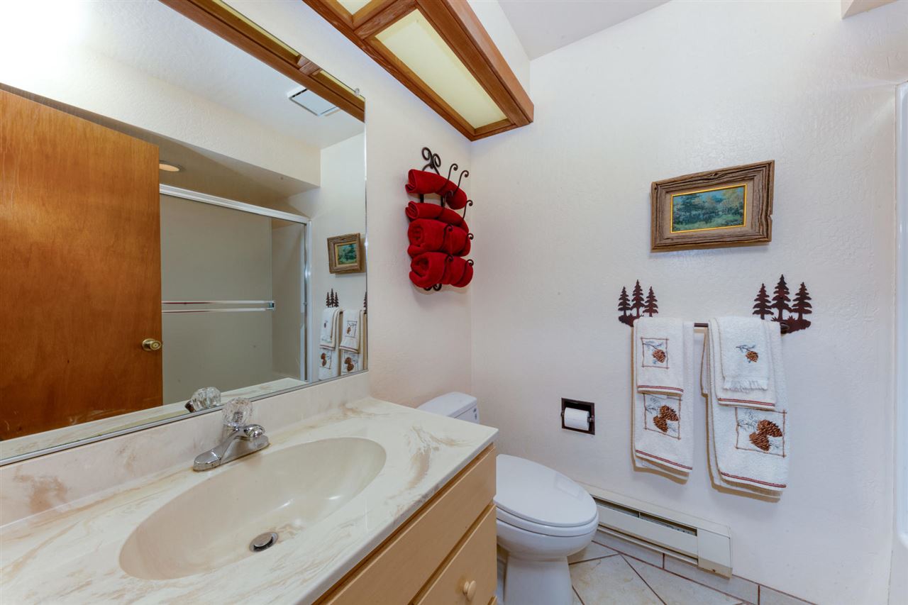 92 Graeagle Meadows Road Graeagle, CA 96103 - Photo 8 of 19 a bathroom with a sink mirror and toilet