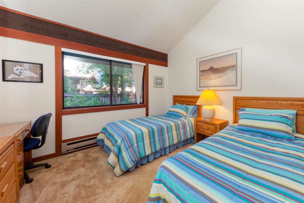 92 Graeagle Meadows Road Graeagle, CA 96103 - Photo 10 of 19 a bedroom with two beds and a large window