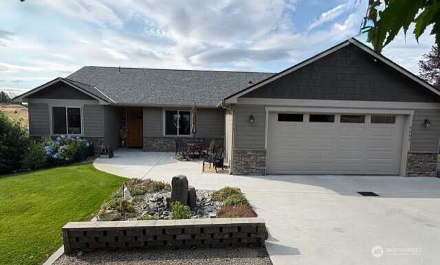 4062 Knowles Road Wenatchee, WA 98801 - Photo 1 of 20 a view of backyard of house with yard