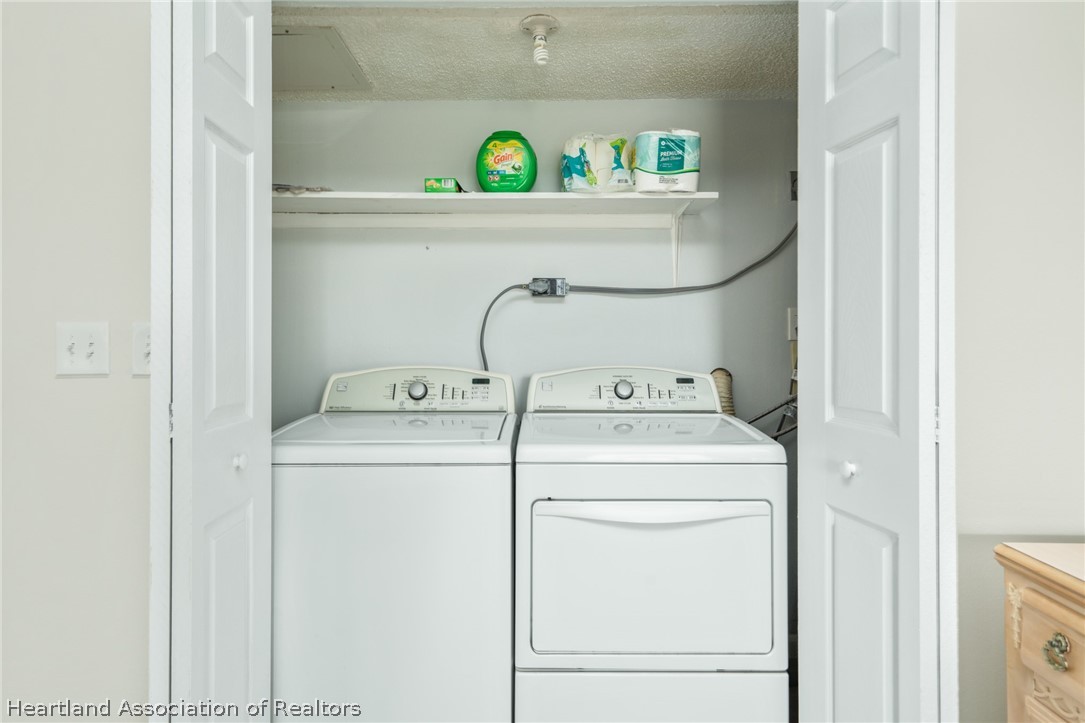 3607 Edgewater Drive Sebring, FL 33872 - Photo 12 of 22 a utility room with dryer and washer