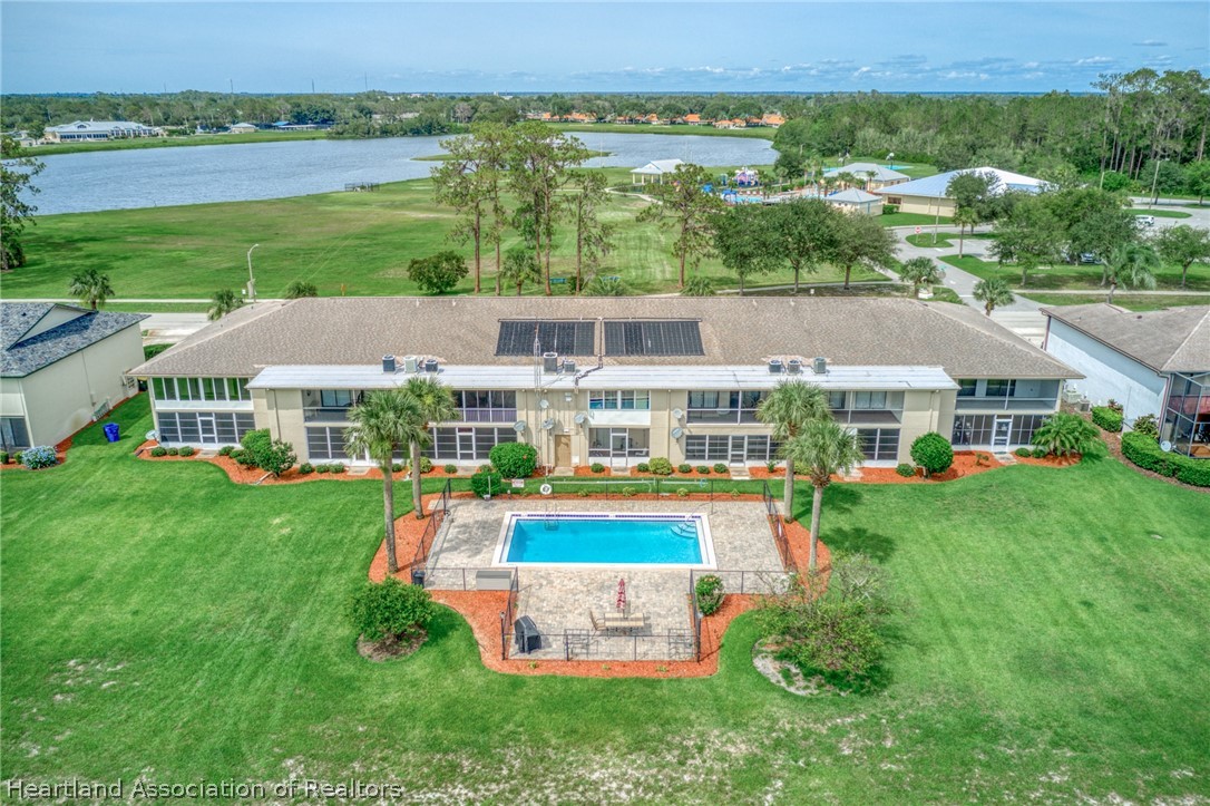 3607 Edgewater Drive Sebring, FL 33872 - Photo 18 of 22 a aerial view of a house with swimming pool and a yard