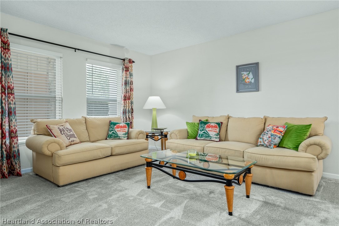 3607 Edgewater Drive Sebring, FL 33872 - Photo 2 of 22 a living room with furniture and a large window